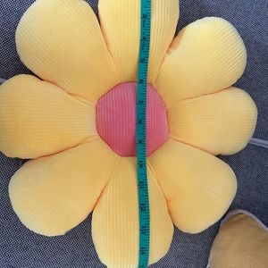 Dorm decor pillows yellow petals peach center so plush.